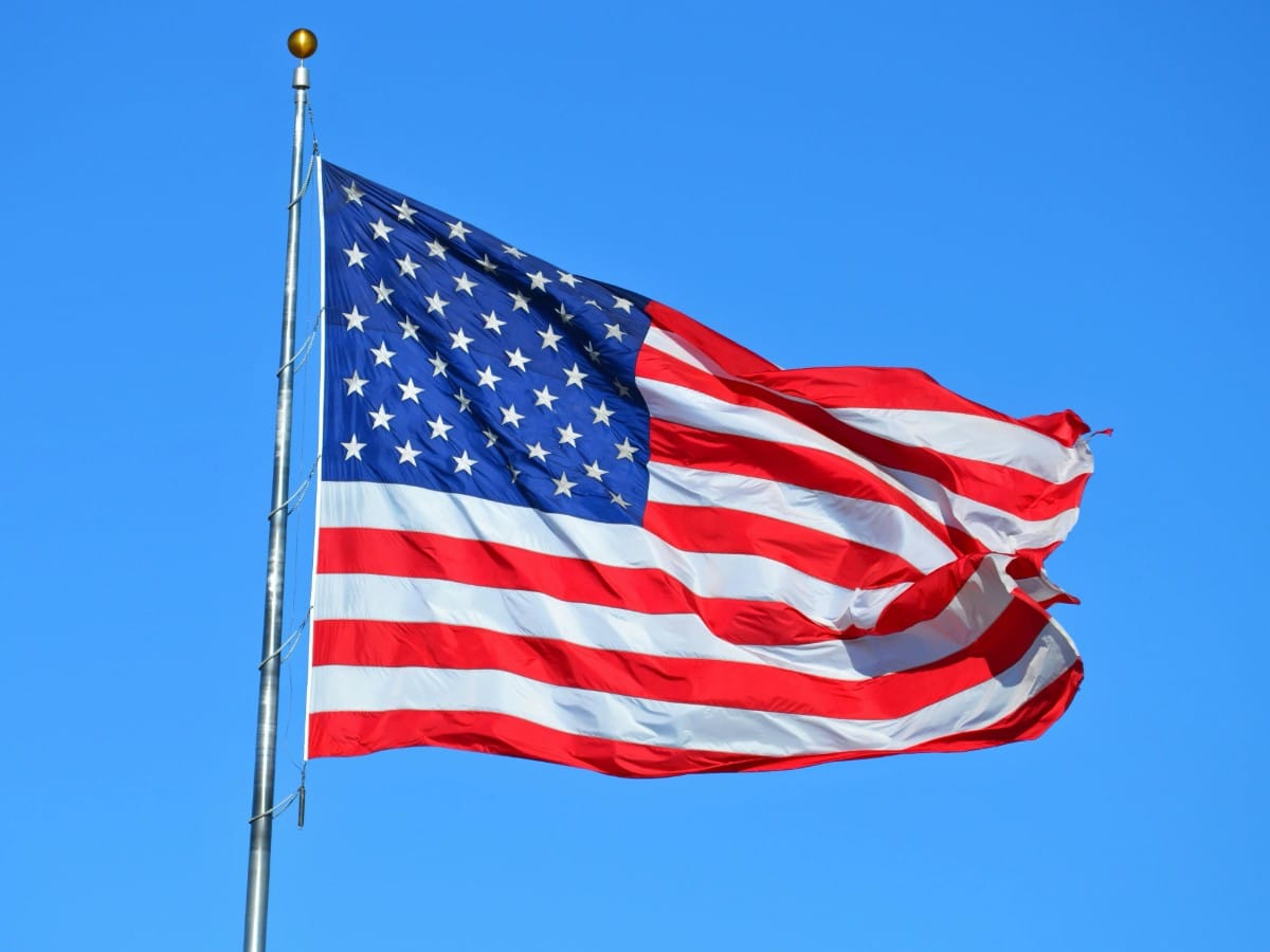 USPS Flag stamps and Scott catalog reference guides for corporate postal inventory.