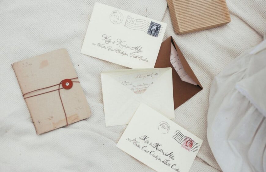 discount forever stamps cheap in bulk arranged on a desk