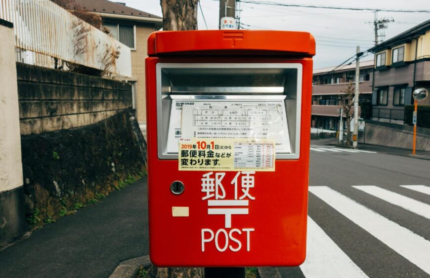 mail carrier collecting letters stamped with discount forever stamps