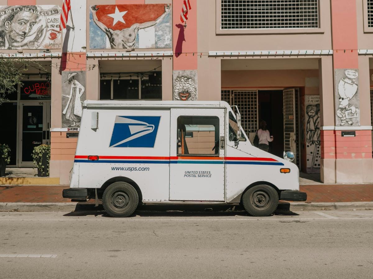 An operations manager in Phoenix reviewing a verified coil for bulk buy postage stamps online.