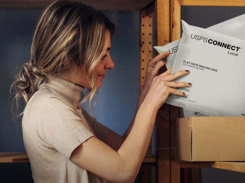 Person with USPS Connect packages